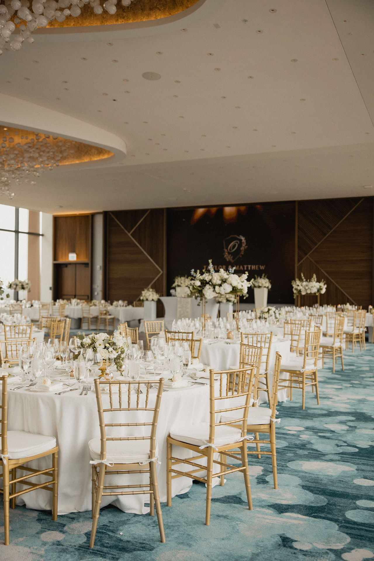 Reception room with tall floral arrangements
