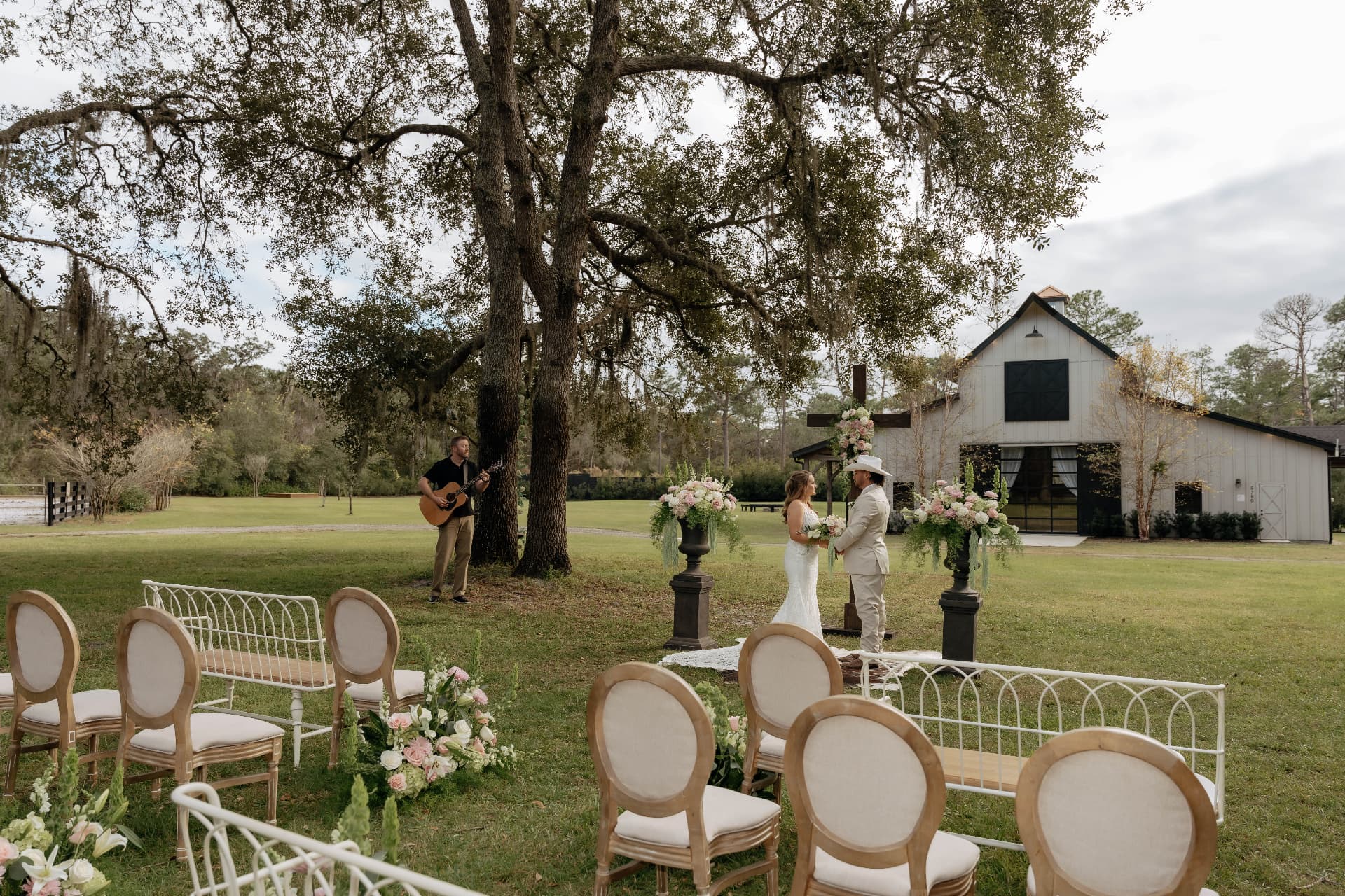 Outdoor ceremony with floral arrangements in a meadow